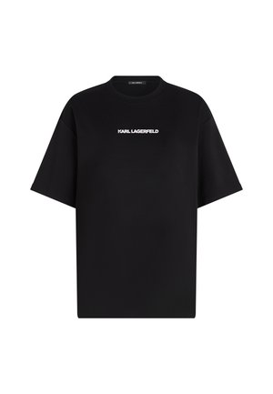Black oversized t-shirt made of cotton with a crew neckline and short sleeves; features white "KARL LAGERFELD" logo on the front.