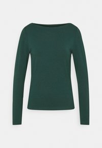 Långärmad, mörkgrön topp med vid halsringning mot en enkel vit bakgrund, vilket visar dess enkla och eleganta design.