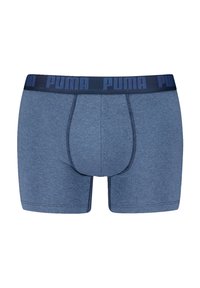 Plave pamučne bokserice s mornarskom elastičnom trakom na kojoj se nalazi "PUMA" logo. Glatka tekstura s kontrastnim šavovima. Dizajn srednje dužine.
