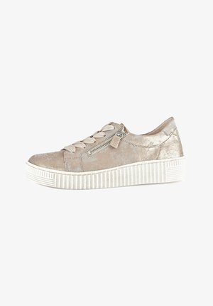Beige suede sneaker with a textured finish, lace-up design, side zip closure, and a white ridged sole.