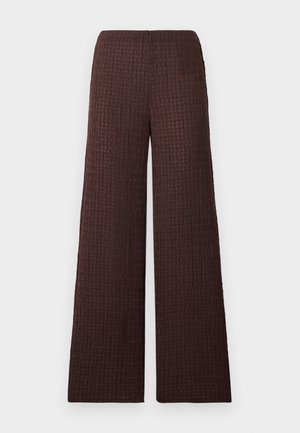 Wijd uitlopende bruine broek met textuur en een elastische tailleband, ontworpen in een gerimpelde stof en met volledige lengte.
