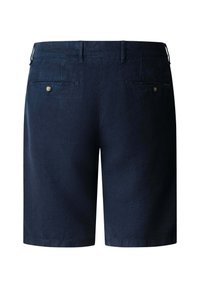 Pantalones cortos azul marino a medida con presillas para cinturón y dos bolsillos de ojal con botones en la parte trasera, mostrados extendidos desde atrás.