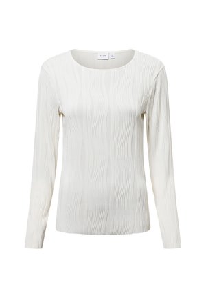 Top de manga larga en suave tejido color crema claro con un patrón de olas texturizado y un escote redondo amplio. Diseño liso y ajustado en toda la prenda.