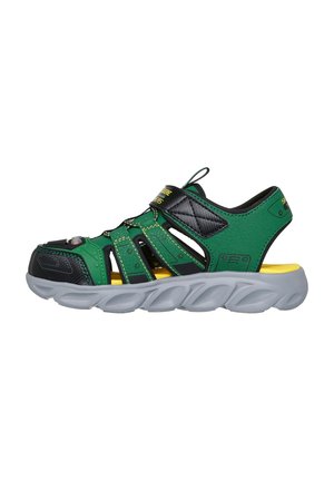 Green and black synthetic sandals with adjustable strap, grey cushioned sole, and yellow accents. Includes breathable cutouts and textured detailing.