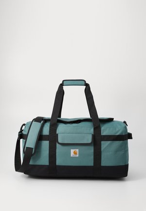 Sac de sport teal et noir en tissu durable. Comprend des poignées de transport doubles, une bandoulière réglable et une fermeture supérieure zippée.