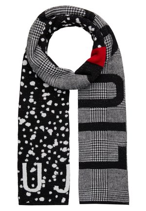 Black and white patterned scarf with block and houndstooth designs, white scattered spots, and a small red patch near the top.