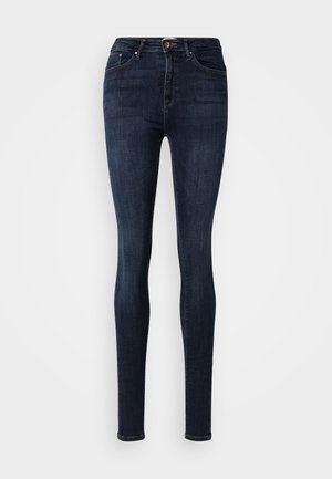 Jeans skinny in denim scuro con vita media, dotati di chiusura frontale con bottone, classico design a cinque tasche e dettagli di leggera scoloritura.