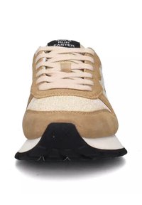 Beige suede and mesh sneaker with cream accents, flat laces, and a black heel counter. Features a rubber sole and rounded toe design.