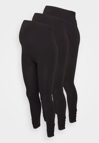 Trois paires de leggings noirs taille haute, présentant une texture lisse et une coupe ajustée, adaptées pour le port pendant la grossesse.