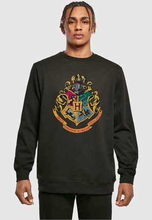 Sort sweatshirt med et farverigt Hogwarts våbenskjold design og detaljeret udsmykning. Lavet af bomuldsmateriale, rund hals, ribbede manchetter og kant.