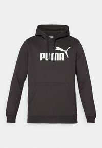 Schwarzer Kapuzenpullover mit einer vorderen Kängurutasche, der ein markantes weißes "PUMA"-Logo und eine weiße Puma-Silhouette zeigt. Weicher Stoff.