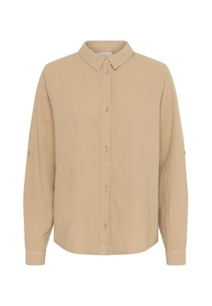 Camicia beige a maniche lunghe con collo classico, chiusura a bottoni e maniche arrotolate. Realizzata in tessuto morbido con una texture liscia.