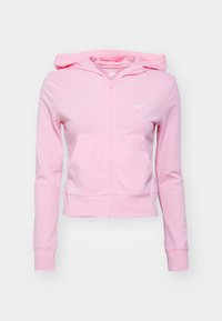 Ljusrosa zip-up hoodie för kvinnor med frampocketar, fast huva, långa ärmar och en liten vit Nike-logotyp på bröstet.