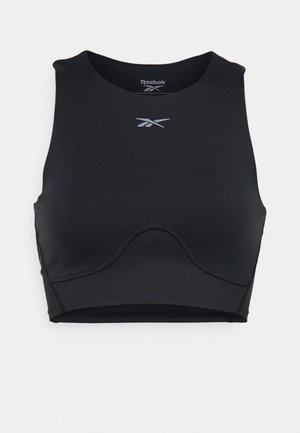 Svart sportbh laget av elastisk stoff, med rund halslinje, racerback-design og en subtil Reebok-logo i sølv i midten.