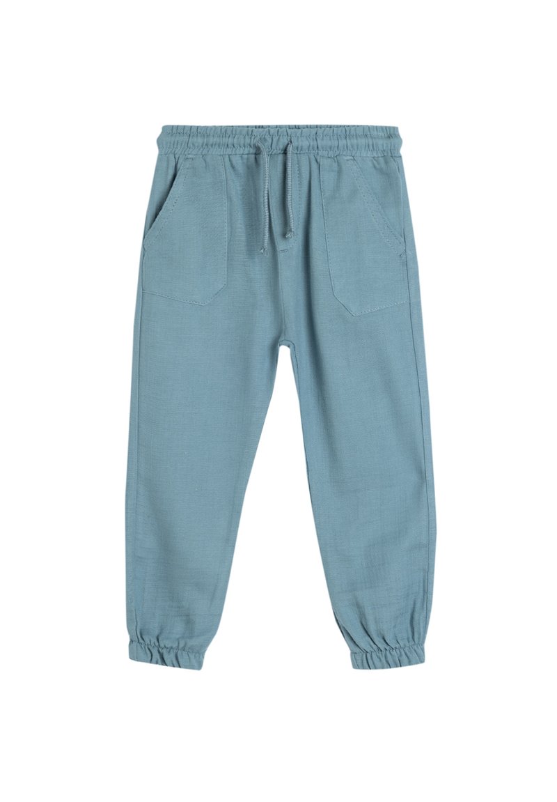 Hellblaue, locker geschnittene Hose mit elastischem Bund, Kordelzug und zwei vorderen Taschen. Die Bündchen sind ebenfalls elastisch.
