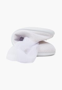 White slip-on shoes with mesh detailing, featuring a soft, sheer fabric bow at the front, displayed on a plain background.