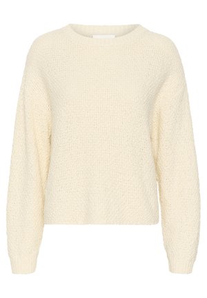 Pull en tricot de couleur crème avec un col rond, des épaules tombantes et des poignets à côtes. Présente un motif de point texturé.