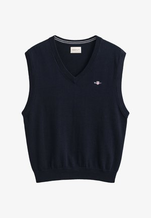 Laivastonsininen, hihaton neuleliivi V-pääntiellä, resorireunuksilla ja hihansuuaukoilla, jossa pieni GANT-logo, jossa kilpi rinnassa.