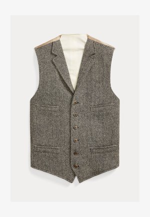 Barna és krémszínű halszálka mintás mellény, mélyített gallérral, hat gombbal és két első zsebbel. Bélése bézs színű anyagból készült.