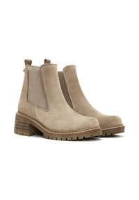 Stivaletti ankle in suede beige con pannelli elastici laterali, tacco impilato e suola testurizzata. Presentano dettagli di cucitura e linguette sul retro.