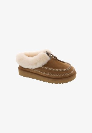 Brown suede slipper with cream faux fur collar, decorative stitching, and lace detail at the front. Rubber sole for traction and durability.