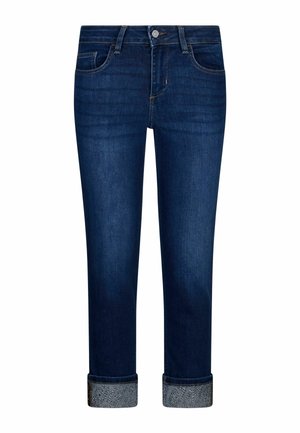 Tumši zili džinsa bikses ar uzrollētām aprocēm, uz kurām redzamas apgleznotas sudraba pērlīšu detaļas.