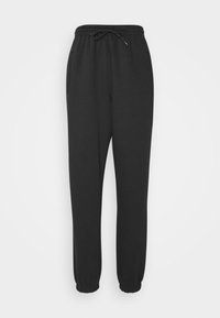 Svarta sweatpants i mjukt tyg med elastisk midja och dragsko. Har sidofickor och elastiska muddar vid anklarna.