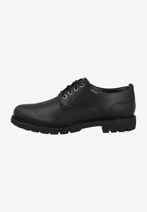 Chaussures noires en cuir à lacets avec une finition lisse, un bout rond, des accents contrastants et une semelle en caoutchouc texturée pour une meilleure adhérence.