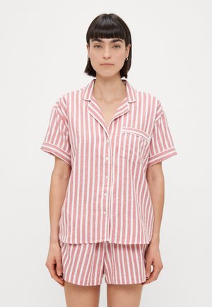 Striped short-sleeve pajama set in pink and white, featuring buttons, a chest pocket, and a loose fit. Made of soft, lightweight fabric.
