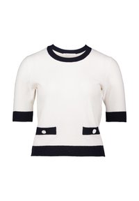 Korte mouw witte trui met zwarte accenten op de kraag en zakken. Textuurstof, met twee decoratieve knopen op de voorzakken.