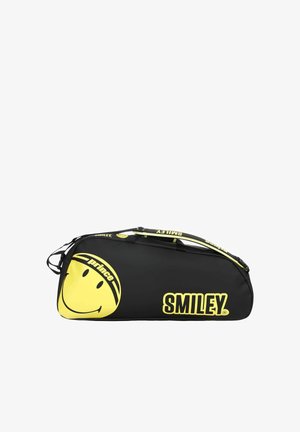 Zwarte sporttas met gele smiley, tekst "prince" in het gezicht en het "SMILEY" logo, met bijpassende gele en zwarte schouderriem.