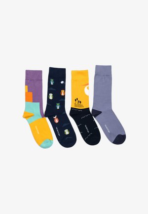Four pairs of colorful socks featuring various designs: purple with geometric shapes, navy with owl patterns, yellow with a landscape, and light grey.
