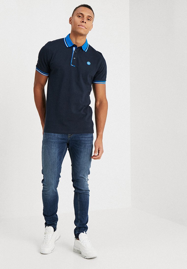 blue polo black jeans