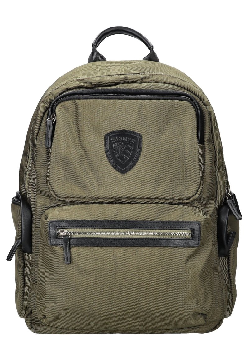 Sac à dos vert olive en tissu durable, avec une poignée supérieure, plusieurs poches zippées et des accents en cuir noir.