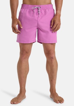 Rosa Badeshorts mit elastischem Bund, Kordelzug und Seitentaschen. Hergestellt aus leichtem Material; verfügt über eine glatte Textur.