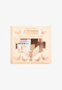 Kit Air Brush Flawless Protect, Prime + Set in una scatola beige mostra due prodotti: una crema primer e uno spray fissante, entrambi etichettati con dettagli.