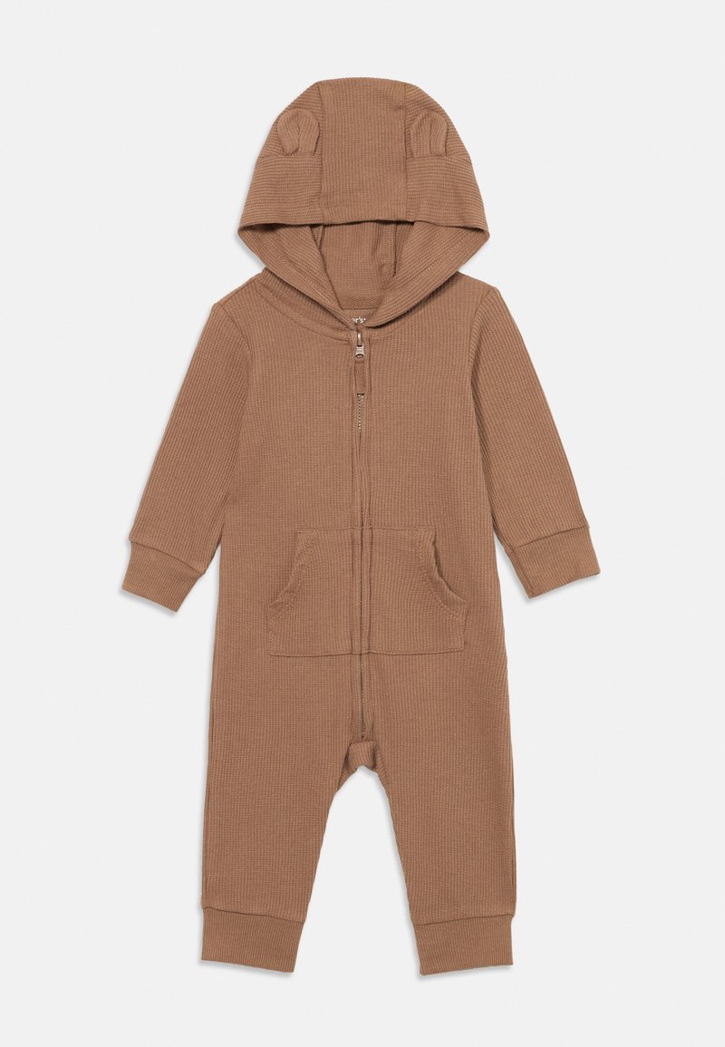 Brown ribbed onesie with a zip front, long sleeves, and a hood featuring small bear ears. Includes two front pockets and fitted cuffs.