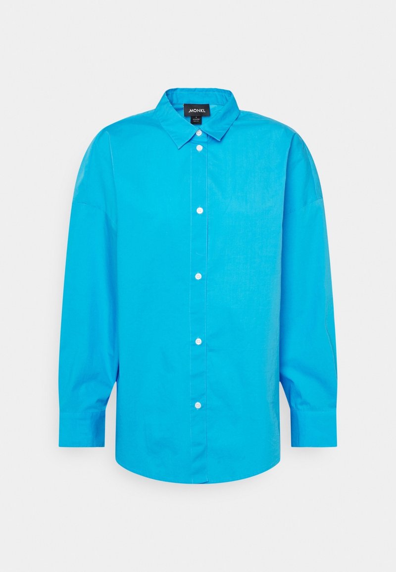Light blue button-up shirt made of cotton blend, featuring a classic collar, long sleeves, and a straight hem with a relaxed fit.