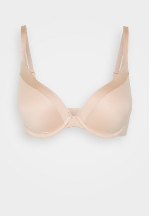 Nude, usztywniony biustonosz z regulowanymi ramiączkami, bezszwowa konstrukcja, gładka tekstura oraz podstawowe wsparcie z fiszbinami. Centralne zapięcie z przodu zapewniające stabilne dopasowanie.
