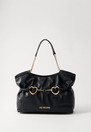 Black leather handbag with chain handles, soft shape, and heart-shaped accents. Features “LOVE MOSCHINO” embossed at the front.