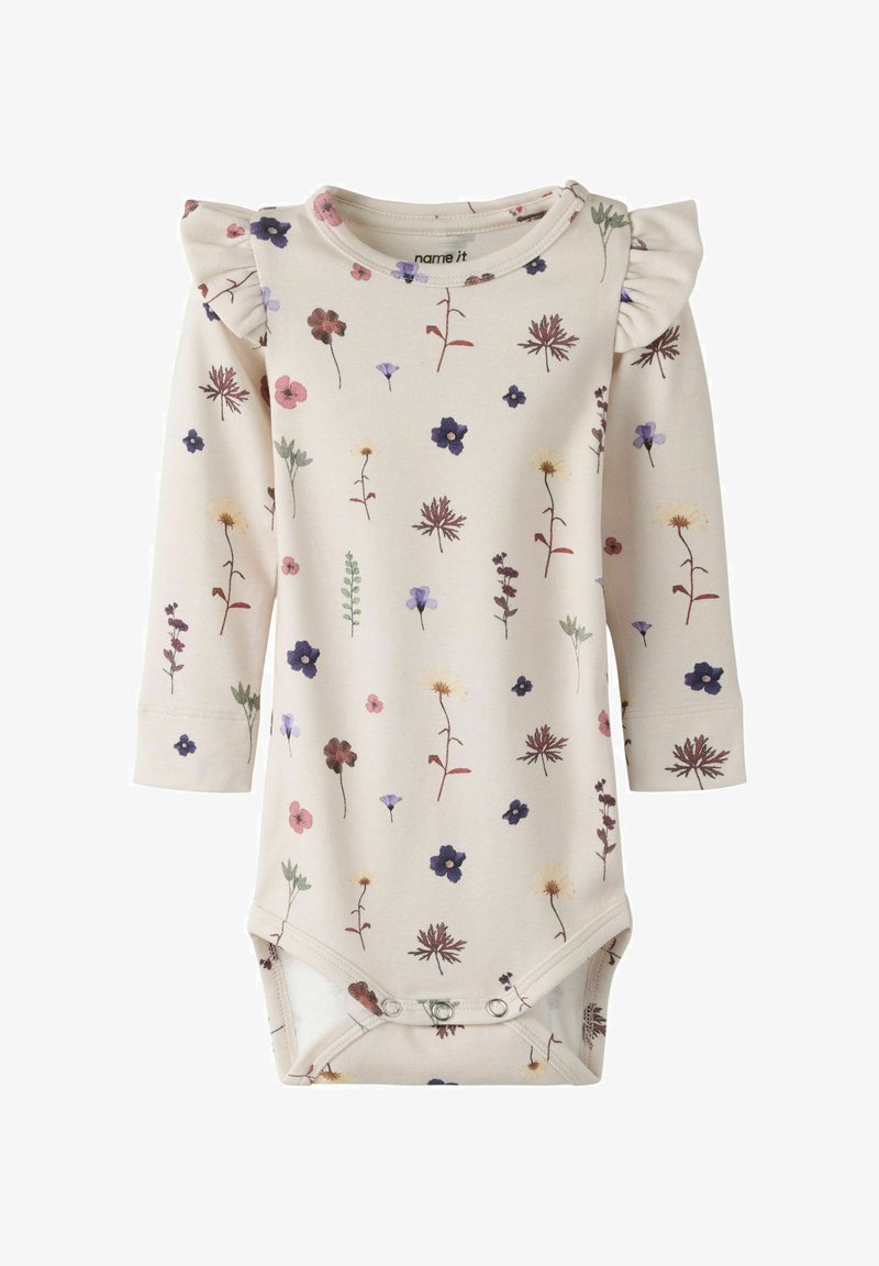 Body bébé manches longues couleur crème avec boutons-pression, orné de petits motifs floraux multicolores et détails à volants sur les épaules.
