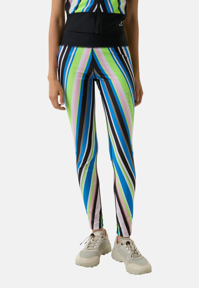 Striped leggings in green, pink, blue, and black with a high waistband. Made of stretch fabric. Paired with beige athletic shoes.