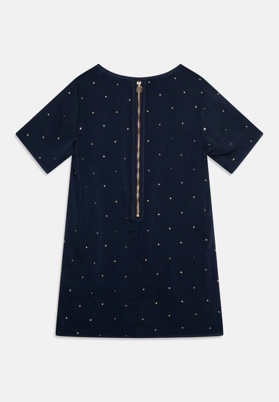 Mørkeblå kortermet kjole med glidelås bak, som har spredte gullprikkemønstre over stoffet for ekstra tekstur og detaljer.