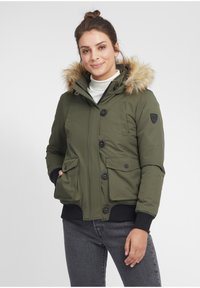 Olive green puffer jacket with a faux fur trim hood, two front pockets, button closures, and ribbed cuffs. Smooth texture and compact design.