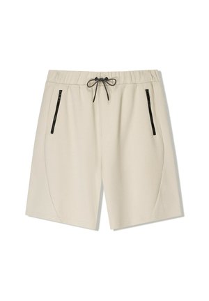 Beige Shorts in Knielänge mit elastischem Bund, schwarzem Kordelzug und schwarzen Reißverschlusstaschen an den Seiten vor weißem Hintergrund.