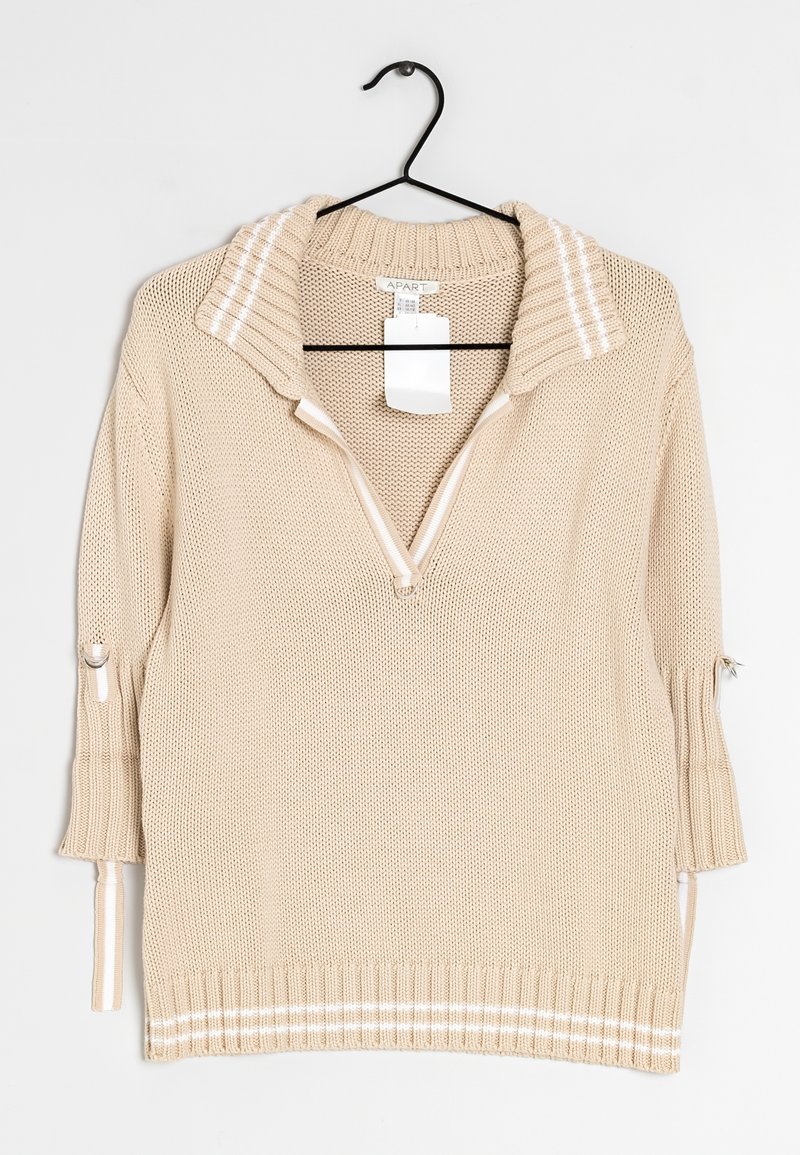 Maglione lavorato a maglia beige con un ampio colletto, zip frontale a metà e dettagli a strisce. Presenta maniche a tre quarti con cordini regolabili.