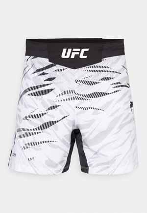 Hvit og svart UFC-bukse med camomønster, med en svart midjebånd og "UFC"-logoen tydelig vist øverst.
