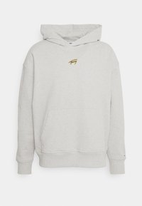 Sweat-shirt à capuche grise en mélange de coton, avec une poche avant et un petit logo brodé sur la poitrine. Coupe standard.