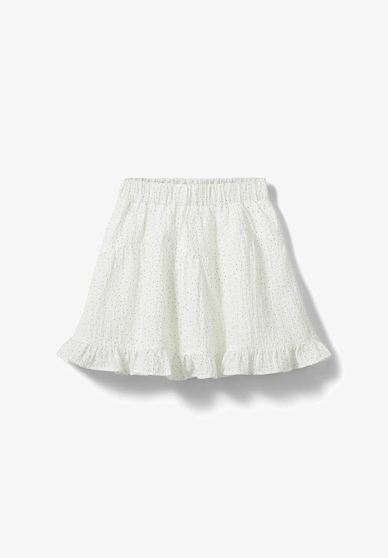 Jupe évasée blanche en tissu léger et texturé avec une taille élastique et un ourlet subtilement froncé, ornée de petits motifs à pois noirs répartis sur toute la surface.