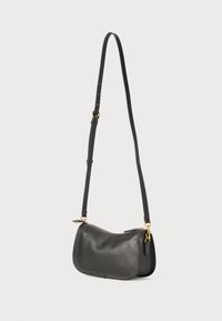 Black leather shoulder bag with a rounded shape, gold zipper closure, and adjustable strap. Smooth texture and minimalistic design.